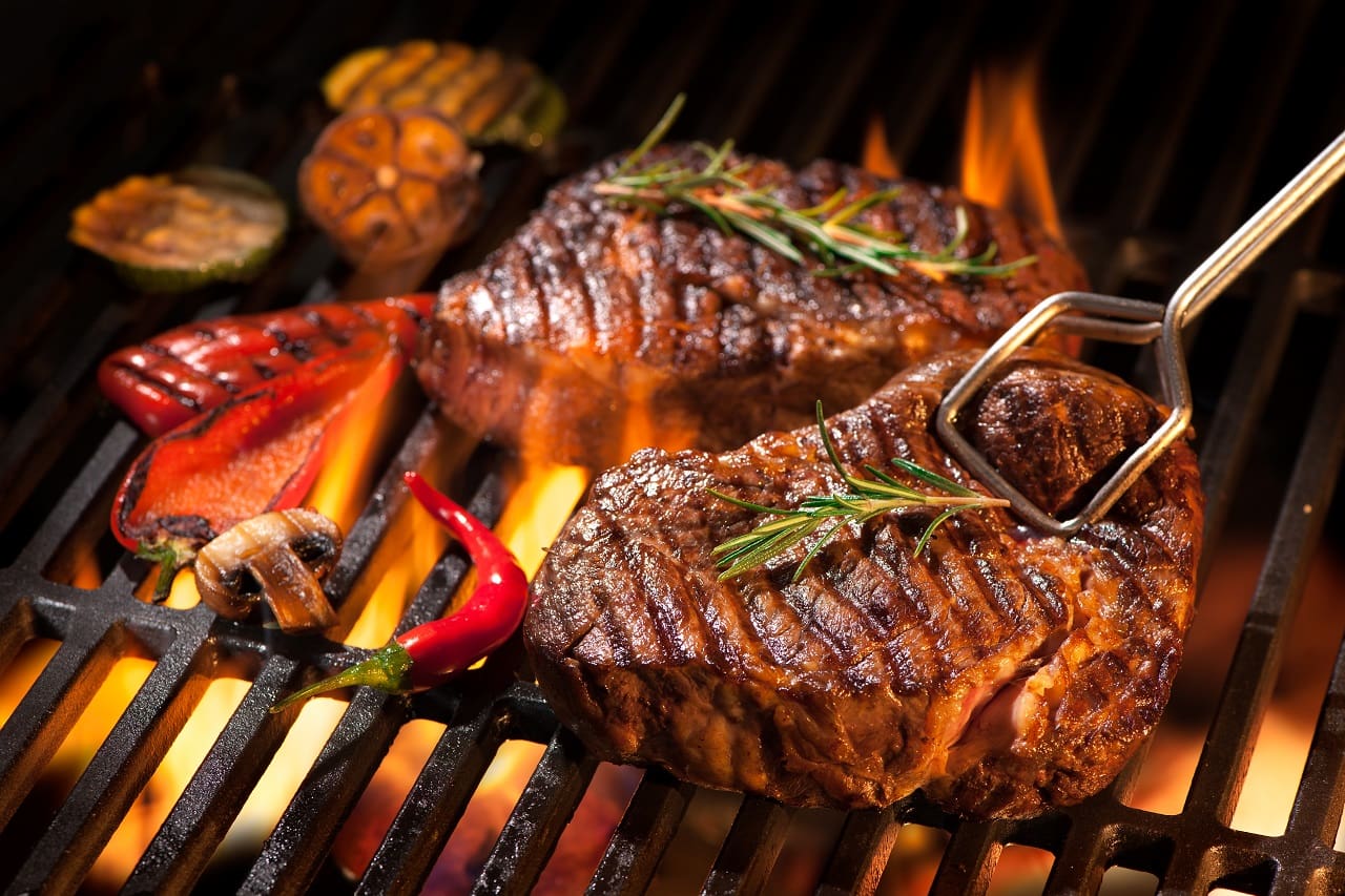 Beef-steaks-on-the-grill-with-flames
