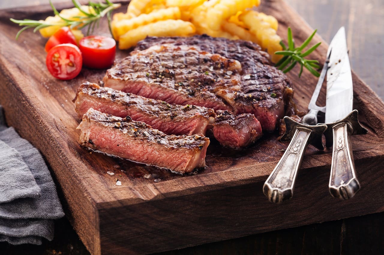 Sliced-medium-rare-grilled-Steak-Ribeye-with-french-fries