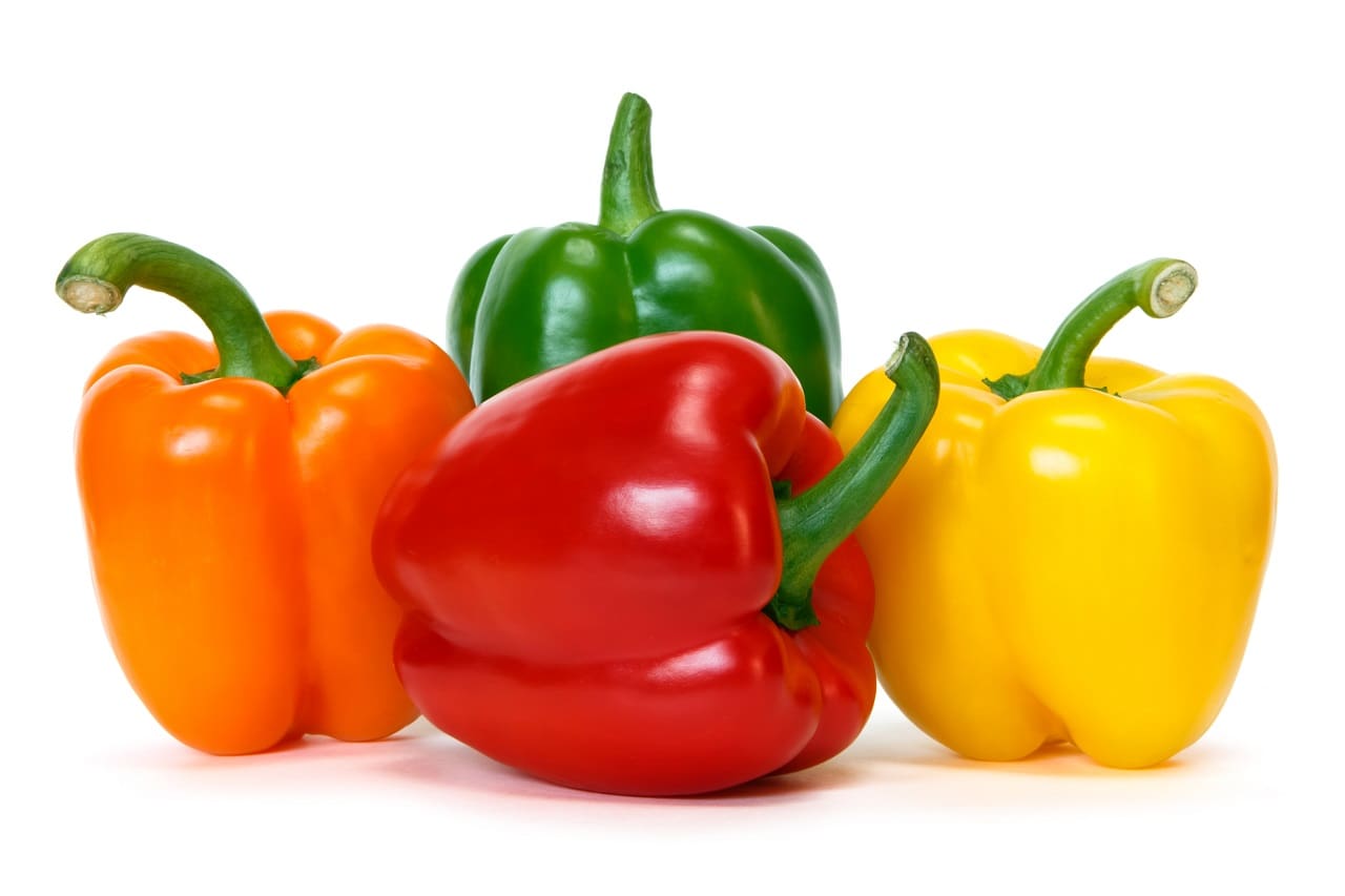 colored-peppers-over-white-background